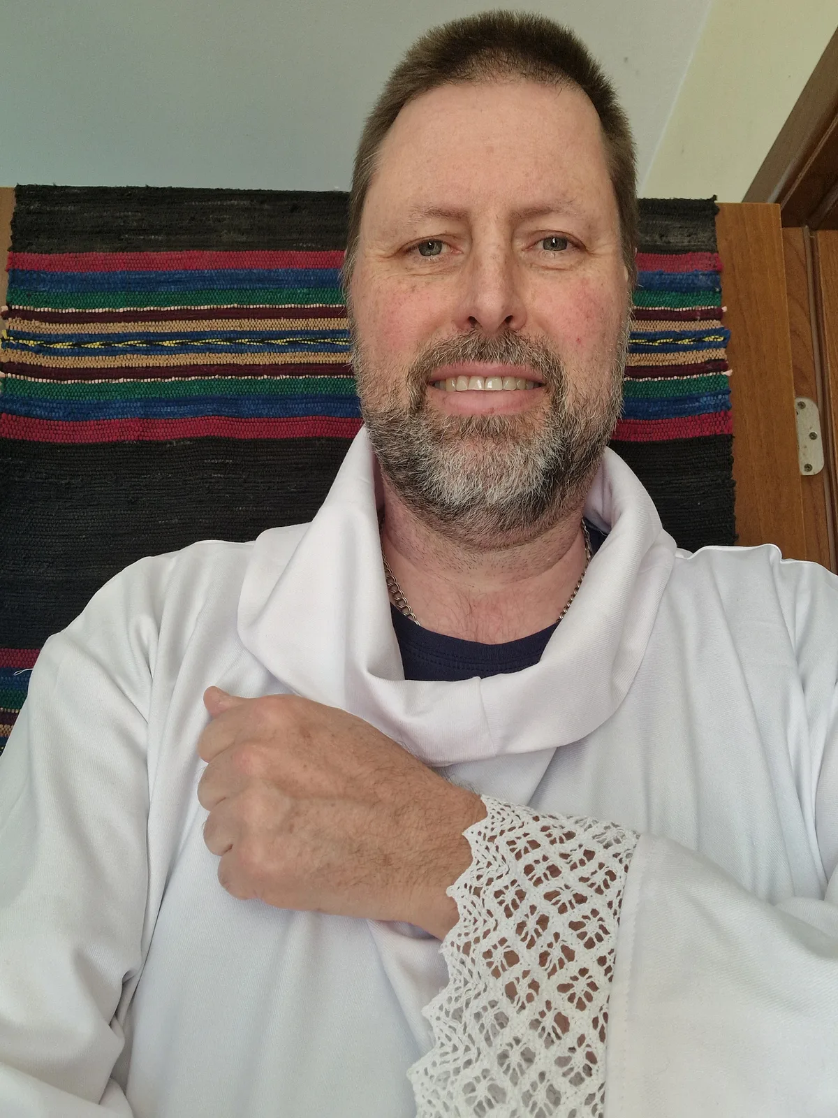 A white liturgical garment with a wide lace cuff.